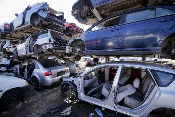 Pile of used old cars at a scrapheap junkyard