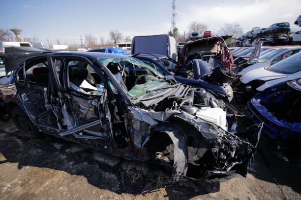 Pile of used old cars at a scrapheap junkyard